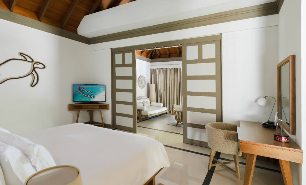 JA_Manafaru_Accommodation_Deluxe Beach Villa_Bedroom_2024.jpg